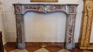 18th-century fireplace in gray marble with pink marble inlays